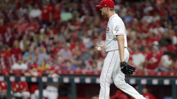 Jul 26, 2019; Cincinnati, OH, USA; Cincinnati Reds relief pitcher Jared Hughes (48) walks back to the mound after giving up a run against the Colorado Rockies during the ninth inning at Great American Ball Park. Mandatory Credit: David Kohl-USA TODAY Sports  